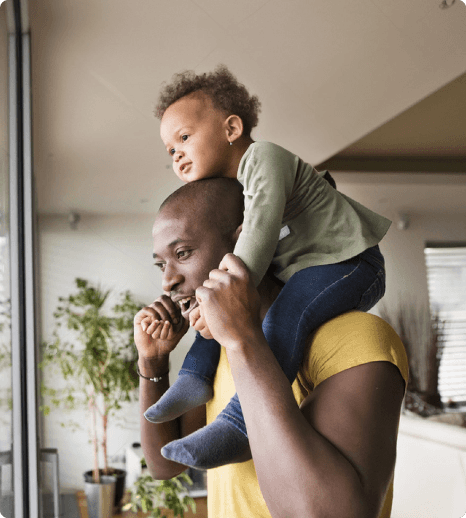 man-holding-child-on-shoulders