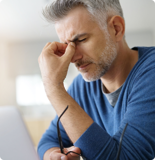 man-pinching-forehead