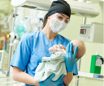 medical-professional-holding-newborn-baby-mobile