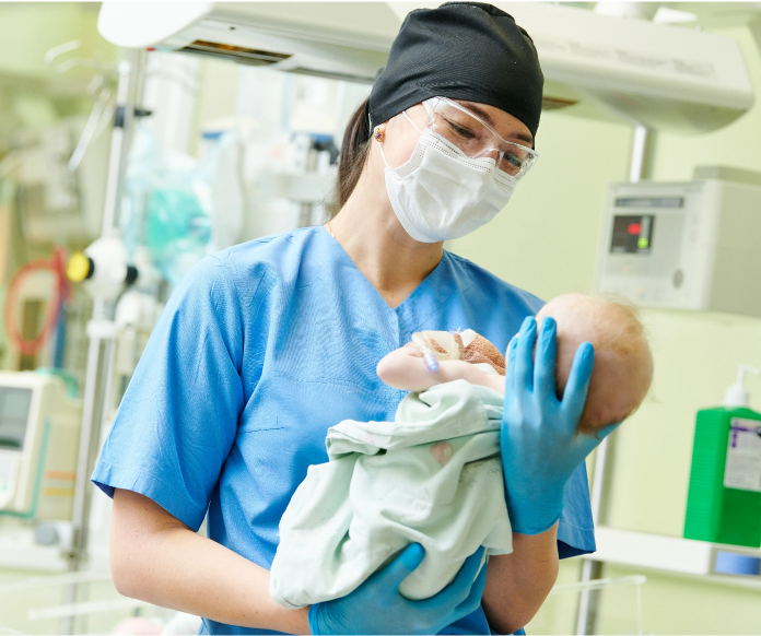 medical-professional-holding-newborn-baby